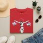 Banksy Crucifixion Balance Tee — Stenciled Jesus Holding Gift Bags Graphic T-Shirt