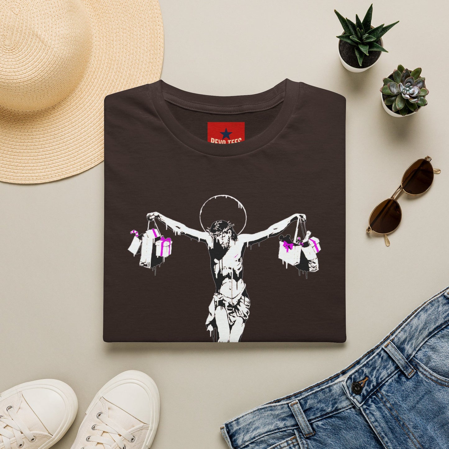 Banksy Crucifixion Balance Tee — Stenciled Jesus Holding Gift Bags Graphic T-Shirt