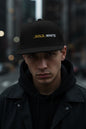 REVOTEES Embroidered Flat Bill Cap – BLACK_GOLD_WHITE Text with rear Gold Star